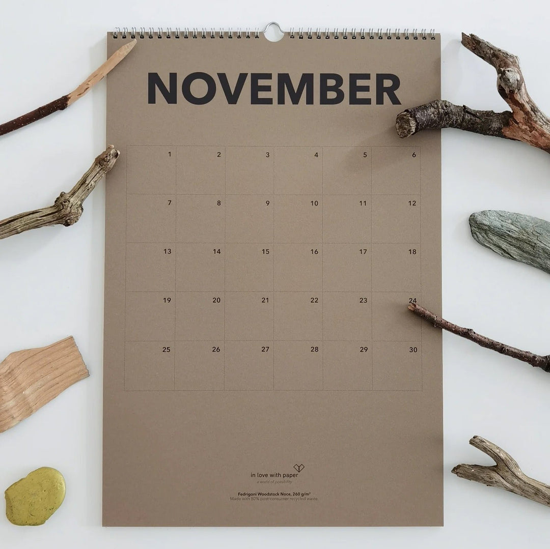 November page of the everlasting calendar adorned with natural elements like branches and stones, creating a rustic autumnal feel.