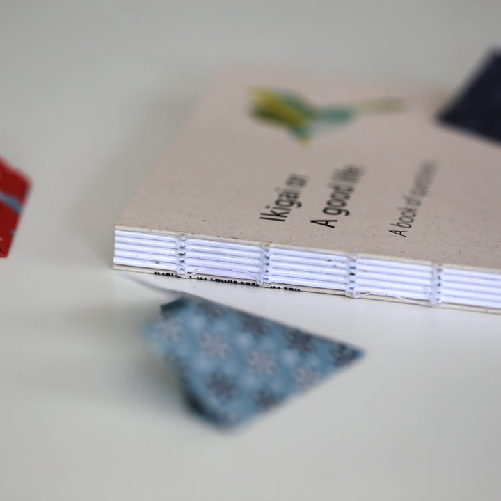 Close-up of the handcrafted binding of the 'Ikigai or A Good Life' book, showcasing its eco-friendly design and artisanal craftsmanship.