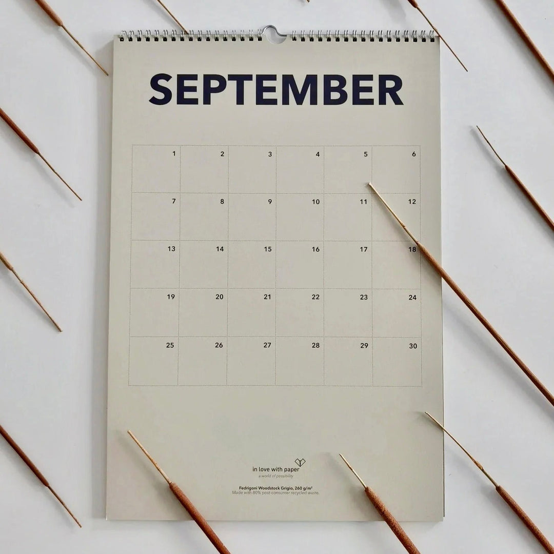 September page of the everlasting calendar, decorated with neatly arranged paintbrushes, adding a creative and autumn-inspired touch.