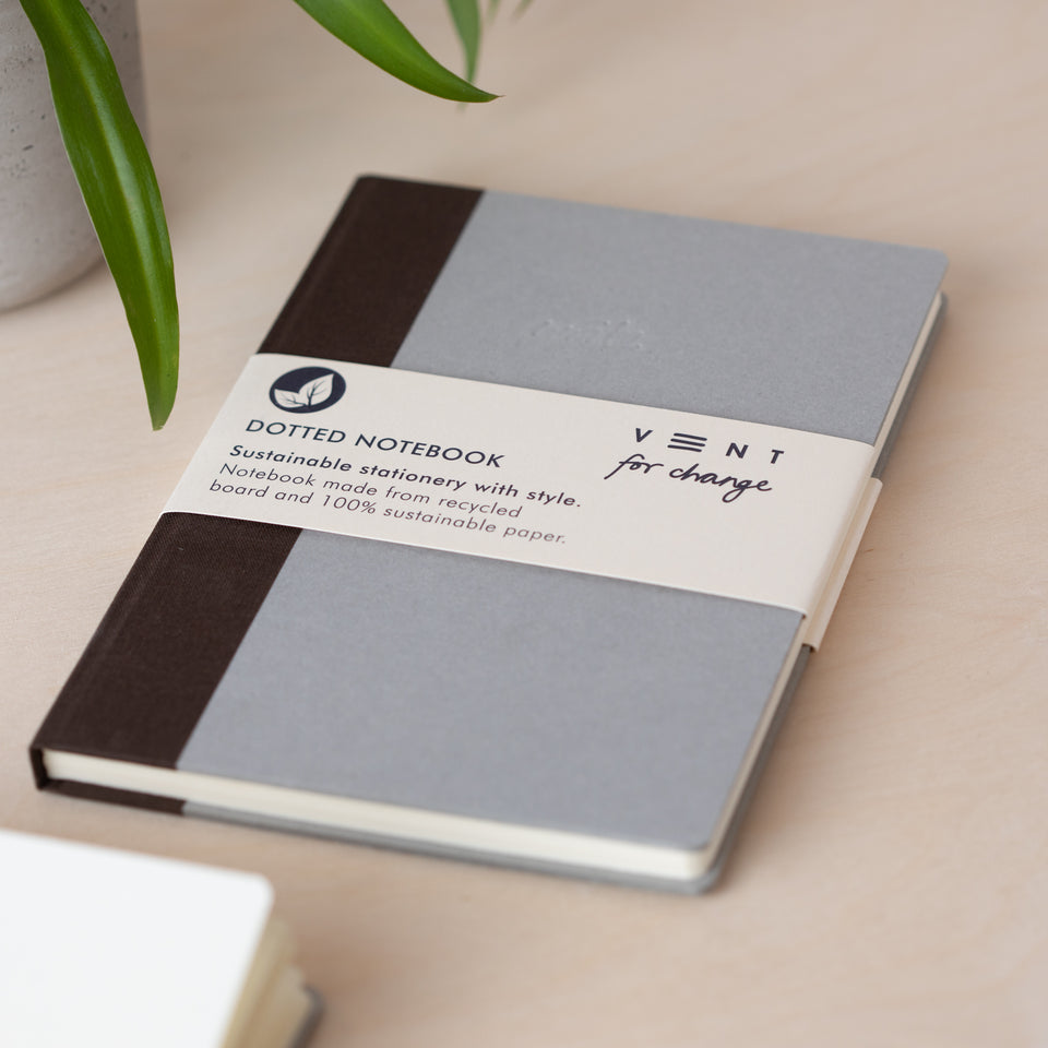 Notebook with recycled cover / vent for change