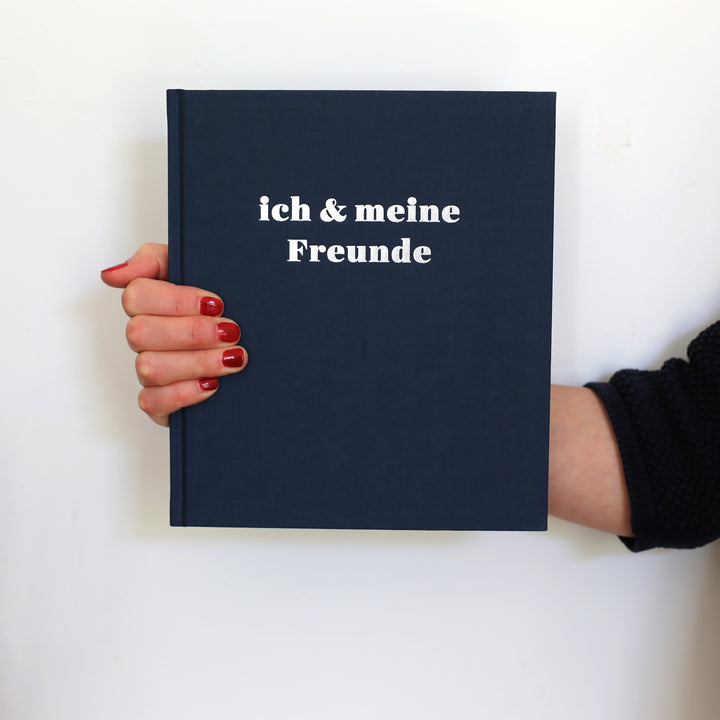 Book of Friendship in German for Adults. dark blue cover with silver colored hot foil embossing. 