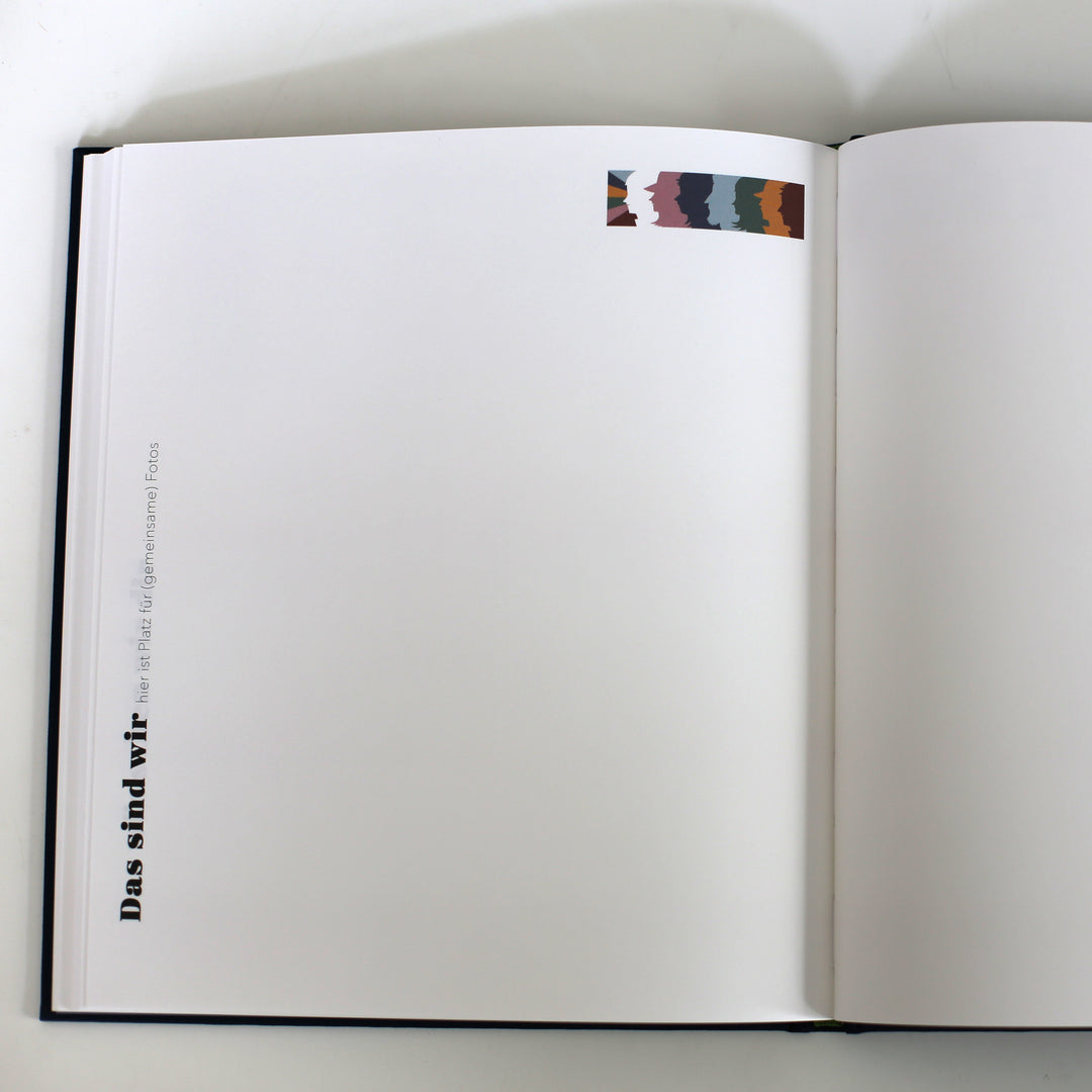 Open page from the "Book of Friendship" titled "Das sind wir," providing space for shared photos and memories.