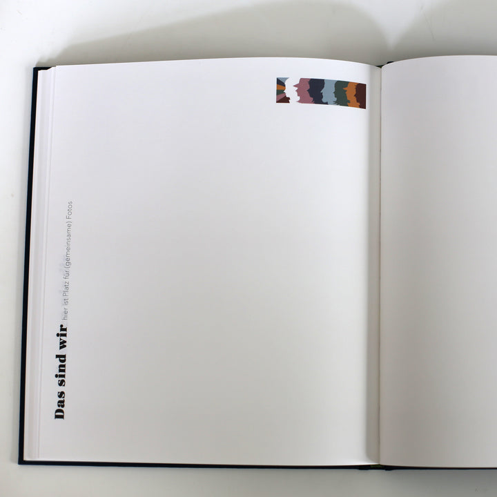 Open page from the "Book of Friendship" titled "Das sind wir," providing space for shared photos and memories.