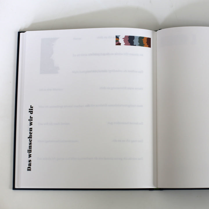 Open page of the "Book of Friendship" with a section titled "Das wünschen wir dir" for personal messages and well-wishes.