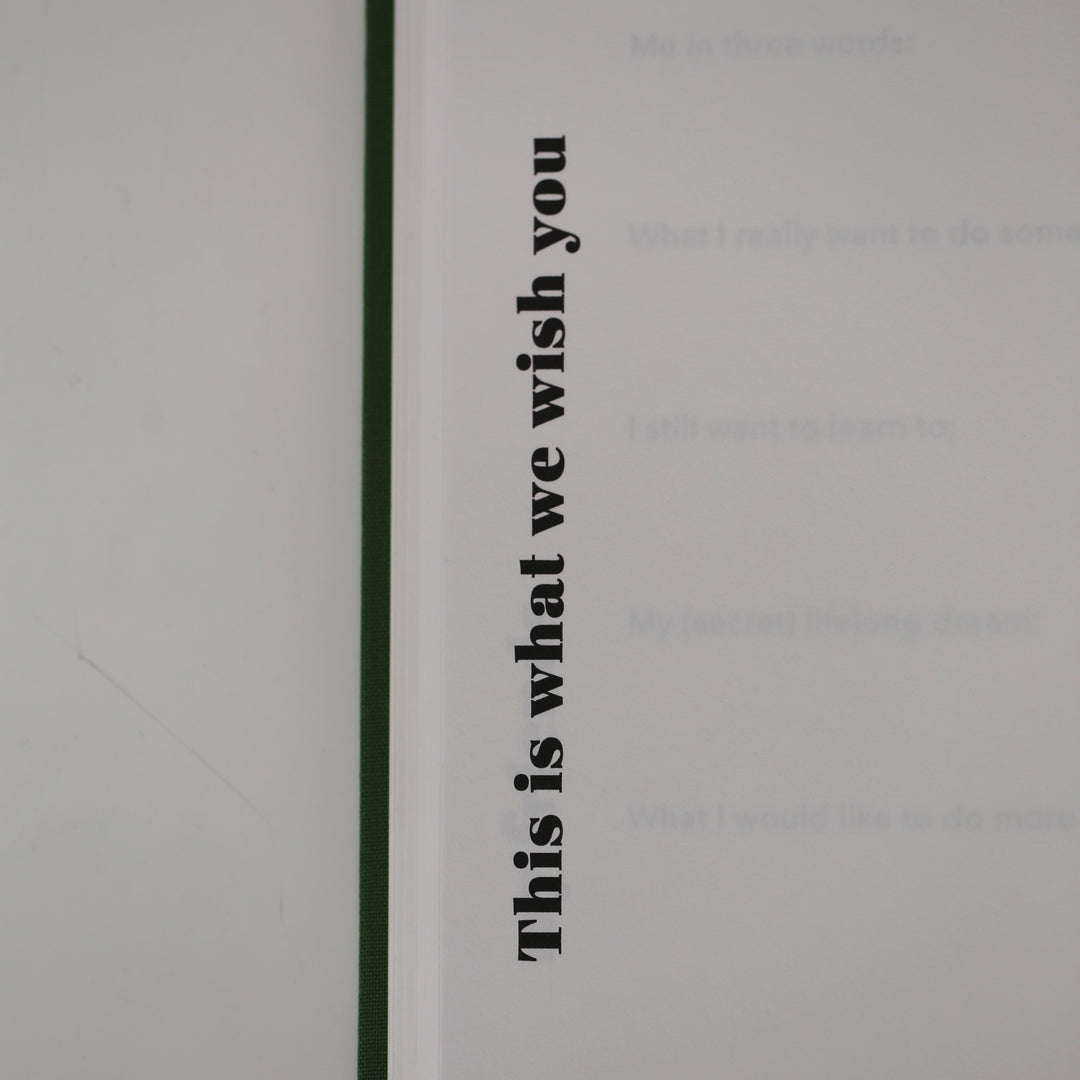 Close-up of friendship book page with the heading 'This is what we wish you,' designed for personal messages and well-wishes.