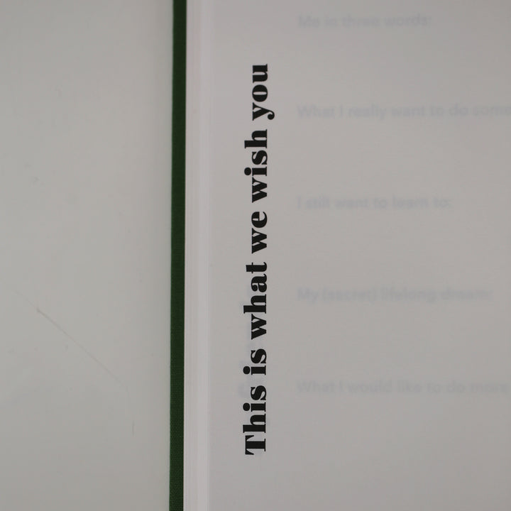 Close-up of friendship book page with the heading 'This is what we wish you,' designed for personal messages and well-wishes.