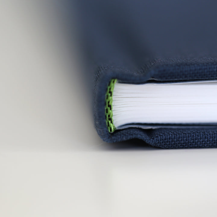 Detailed close-up of the "Friendship Book" binding, highlighting the sturdy spine and high-quality fabric cover.