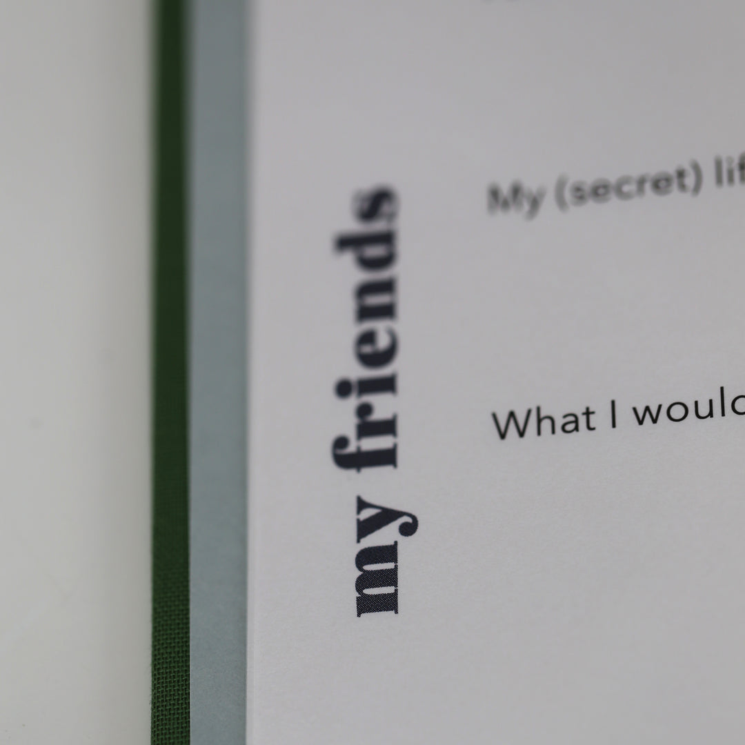 Close-up of friendship book page with 'my friends' section and part of a personal question.