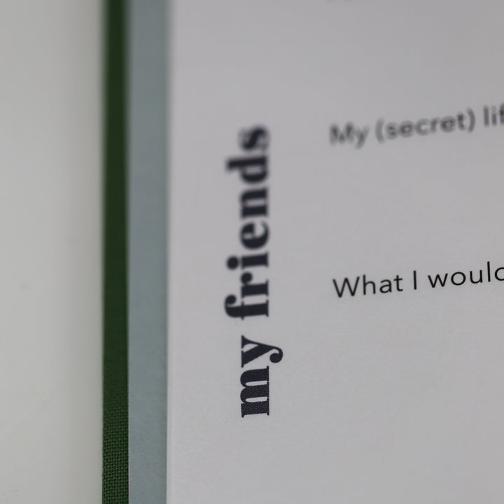 Close-up of friendship book page with 'my friends' section and part of a personal question.